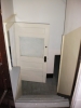 back stairway from kitchen to rear entrance / basement