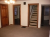 living room - 1st door is front door; then door to 1st floor bedroom, stairway u