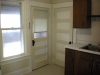 kitchen - doors to broom closet/pantry and back porch