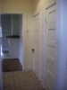 on other side of hallway are 2 coat closets